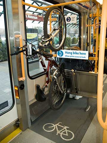 Photo of bike hanging from bike hook on MAX train
