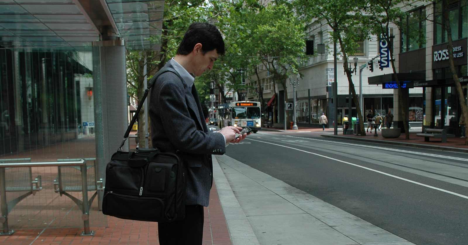 Person accessing TransitTracker on a mobile phone