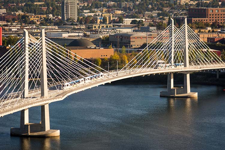 MAX Orange Line trains on the Tilikum Crossing